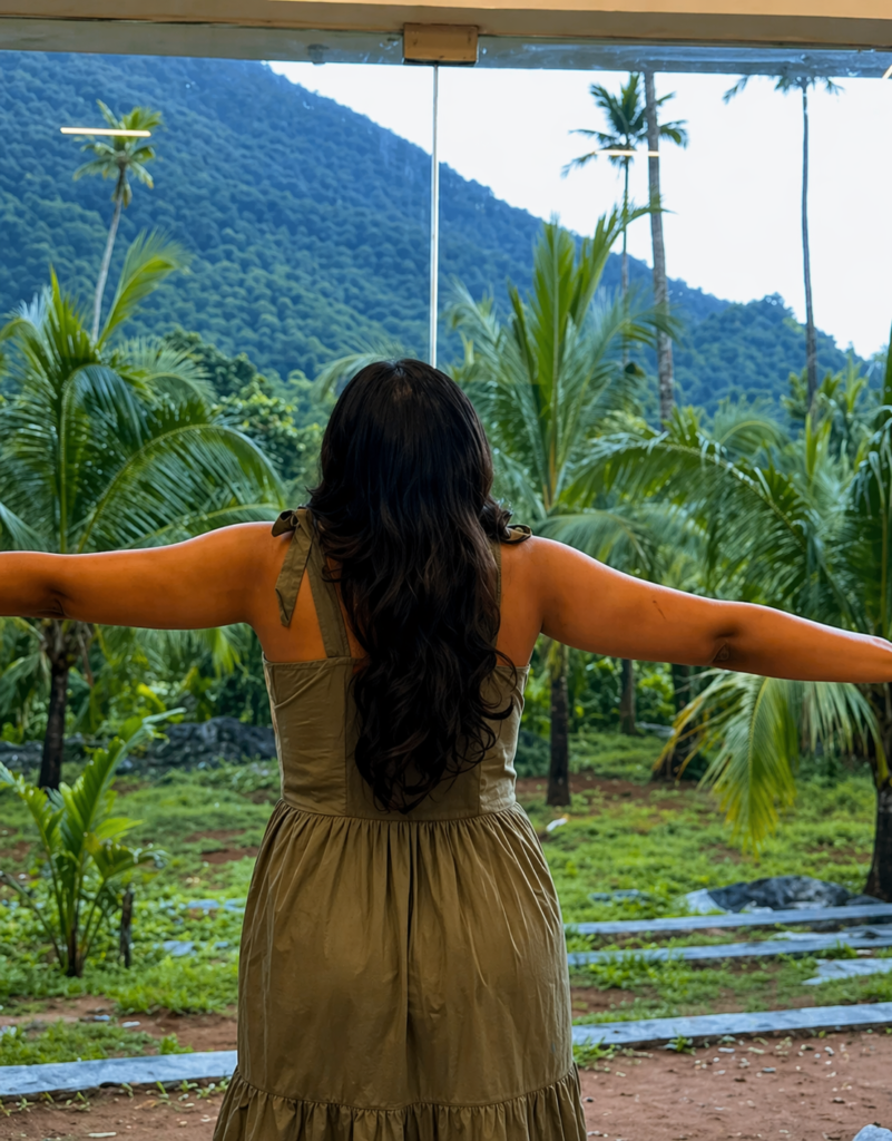 Woman enjoying scenic mountain and greenery view near Ilaveezhapoonchira at Pandora Resort Kudayathoor Kerala
