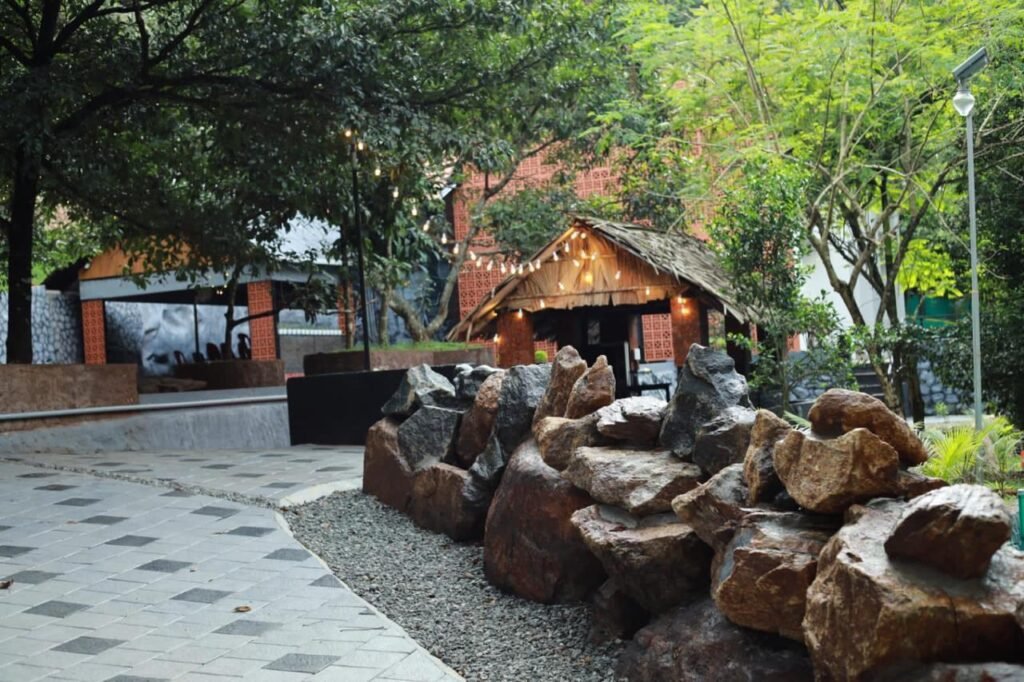 Pandora Resort Kudayathoor walkway and garden area near Vagamon Ilaveezhapoonchira Illikkal Kallu Idukki Kerala